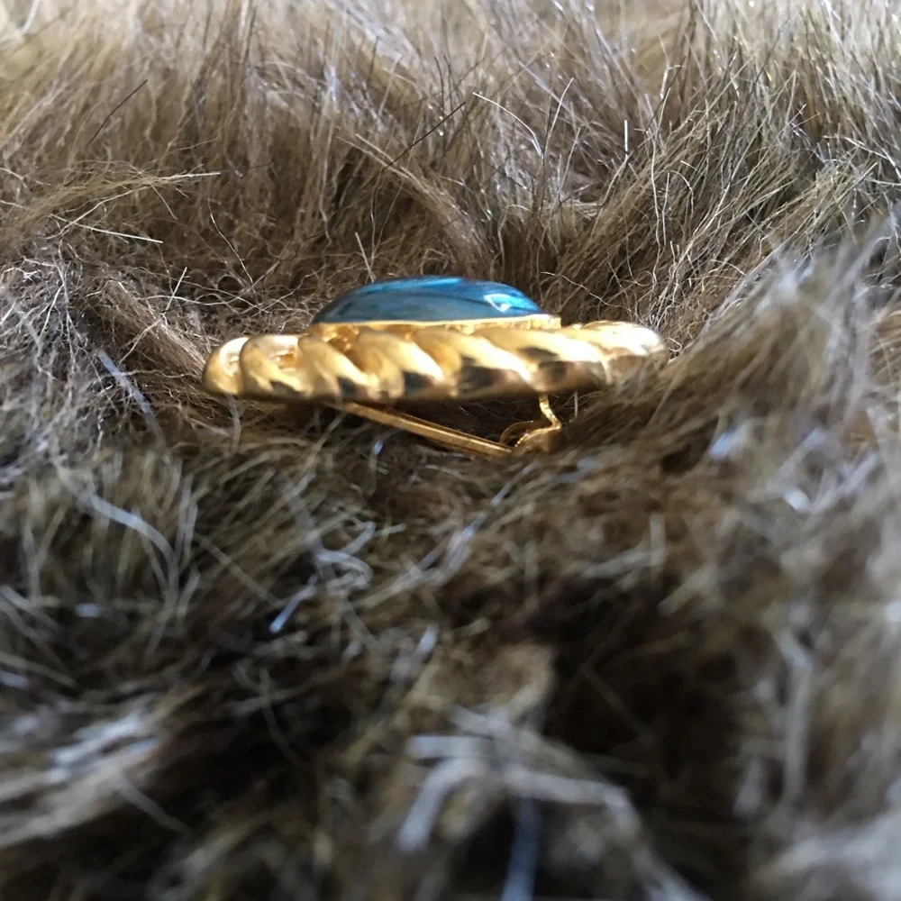 Vintage gold tone swirl blue enamel clip earrings